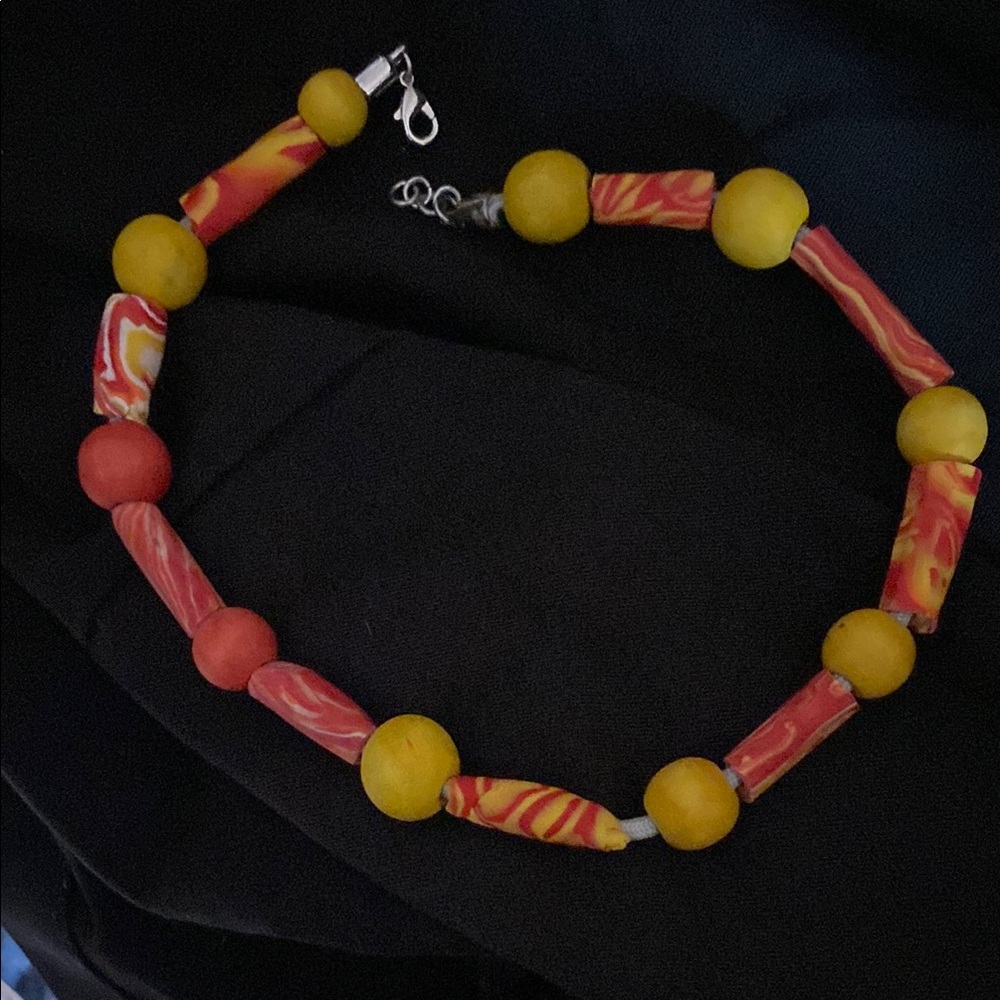 Polymer clay and wood beaded necklace on paracord